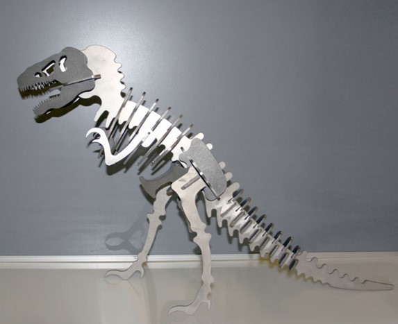 A model tyrannosaurus rex skeleton made of metal.