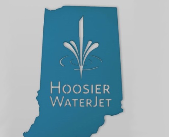 A plastic design in the shape of Indiana with a logo and the words 'Hoosier WaterJet' cut into it.